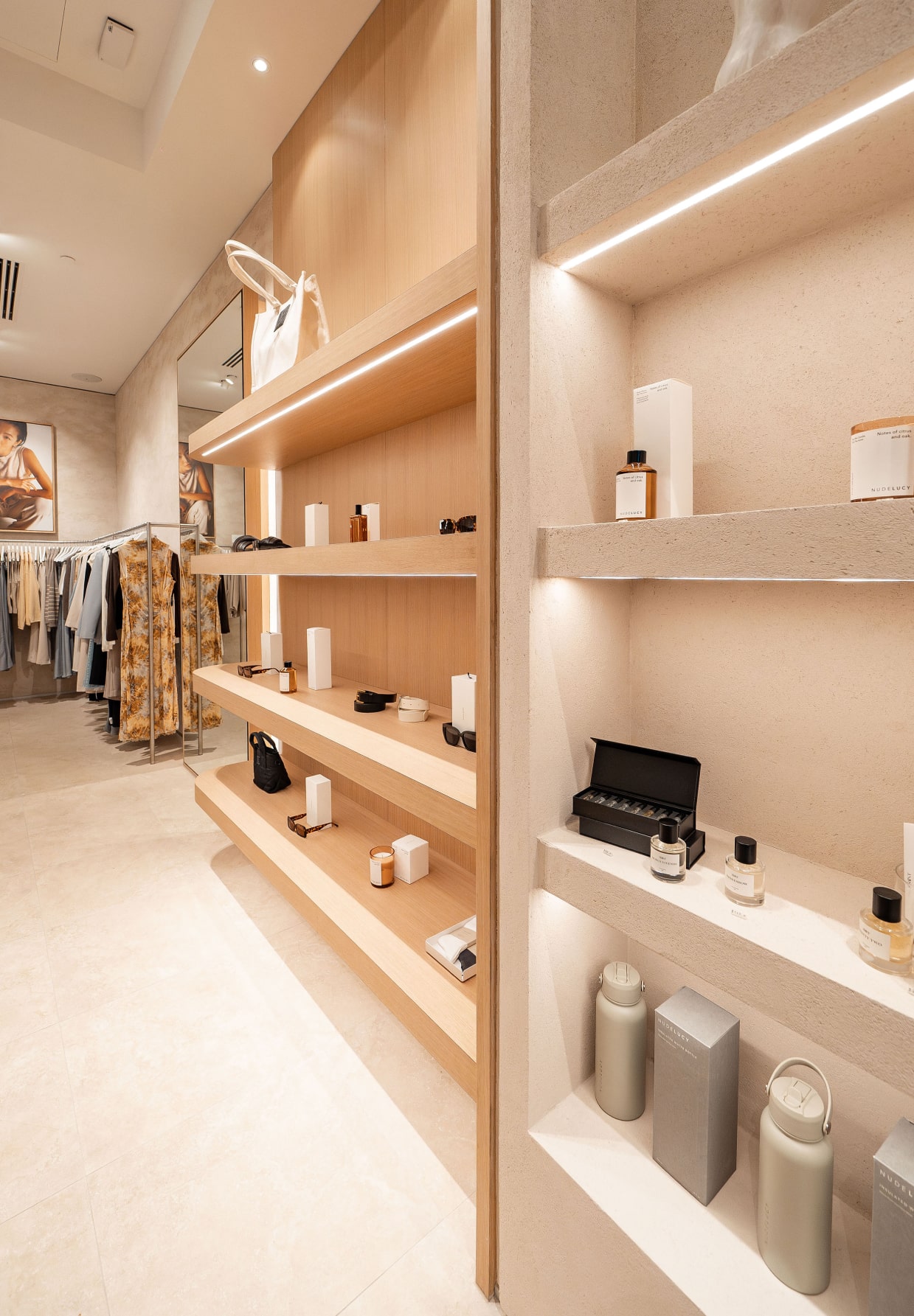 Luxury retail store shelves displaying skincare products, neatly arranged cosmetics, stylish accessories, and elegant packaging.