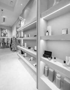 Modern retail boutique with shelves displaying stylish accessories, skincare products, and clothing for fashion-forward shoppers.