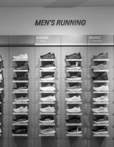 Men's running shoes display, showcasing cushion comfort and bounce energy return options in store.