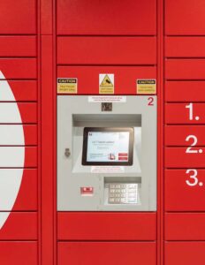 Red parcel locker system with touch screen interface for 24/7 package pickup and secure access keypad.